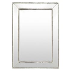 a silver framed mirror on a white wall with an empty space for the image to be taken