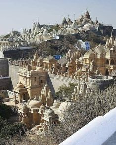 a large group of buildings sitting on top of a hill