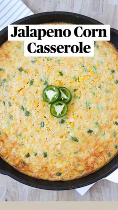 a casserole with cheese and green peppers in a cast iron skillet on a wooden table