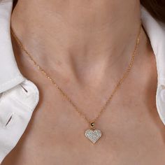 A classic medium sized heart shaped pendant, encrusted with fine quality sparkling micro pavé cubic zirconia. A perfect keepsake or gift for someone special. Remove the charm, and wear the ultra fine rope chain solo, or add other charms of your own! Handcrafted in NYC Nickel free sterling silver 18k gold finish Anti-tarnish coating Heart is is 3/4" | 19mm high Comes in a signature pouch with box Remove electroplated jewelry when bathing, showering or swimming. Avoid direct contact with perfume, Electroplated Jewelry, Heart Shaped Pendant, Heart Shape Pendant, Micro Pave, Rope Chain, Gold Finish, Charm Pendant, Medium Size, Heart Shapes