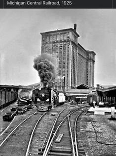 black and white photograph of train coming down the tracks in michigan central railroad, 1932