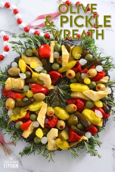 olives and pickle wreath made out of vegetables on a marble surface with text overlay