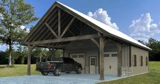 a black truck parked in front of a garage with a roof over the garage area