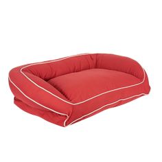 a red dog bed with white piping on the bottom and sides, sitting in front of a white background