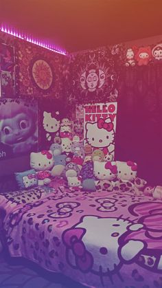 a hello kitty themed bedroom with pink and purple decor on the walls, bedding and pillows