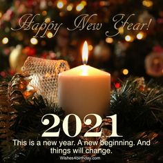 a candle is lit in front of a christmas tree with the words happy new year