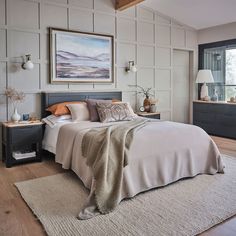 a bedroom with a large bed and two nightstands