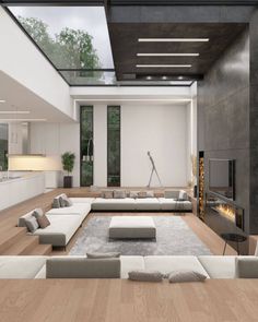 modern living room with white couches and fireplace in the center, surrounded by wood flooring