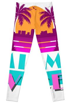 a pair of colorful leggings with palm trees and buildings in the back ground