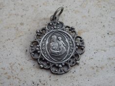 Religious French silvered catholic medal pendant Holy charm medallion of Saint Joseph. Measures : 0,65 x 0,75 inches ( 1,65 x 1,91 cm ). It is possible to engrave a name at the back. I bought this medal on a brocante ( fleamarket ) in France. I have a lot of medals for sale. Please look at all of the pictures, as they complete the description. If you don't have paypal, you can pay by bank transfer. registered shipping is possible but is costing 22 US dollars I deliver all over the world. If you Z Photo, Catholic Medals, Saint Joseph, Saints Medals, St Joseph, Us Dollars, Bank Transfer, French Antiques, Pocket Watch