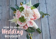 a bridal bouquet with pink and white flowers on a wooden floor in front of a door