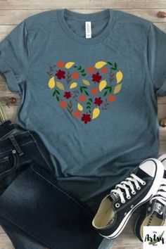 I love fall shirt, fall leaves shirt, leaves in a heart shirt, I Heart fall shirt, cute fall shirt, fall t-shirt, This trendy fall design with a heart made of leaves is a perfect way to show your love of everything fall. The fall leaves design in the shape of a heart says it all! The cute fall shirt would be a great piece of fall apparel to add to your wardrobe. Pair this fall t-shirt with jeans, boots and a jacket or cardigan and you'll be stylin' for the fall season. Cute Fall Tops With Heart Graphic, Cute Heart Graphic Tops For Fall, Cute Heart Print Tops For Fall, Fall Cotton T-shirt With Heart Graphic, Cotton Heart Graphic T-shirt For Fall, Cotton T-shirt With Heart Graphic For Fall, Casual Fall Tops With Heart Graphic, Casual Top With Heart Graphic For Fall, Casual Heart Print Tops For Fall