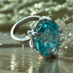 Introducing our stunning Aqua Marine Rings ! A timeless symbol of elegance and beauty! Dive into this world of mesmerizing blue hues that capture the essence of the ocean. Each ring is meticulously crafted to perfection, exuding a sense of luxury and sophistication. Whether you're looking for a statement for a special occasion or a daily reminder of the sea, our Aqua Marine Rings are the perfect choice. Let the refreshing energy of aqua marine inspire you and elevate your style to new heights. Make a splash with your jewelry collection and indulge in the allure of Aqua Marine Rings. Order yours today and experience the magic of the sea at your fingertips. Ocean-Inspired Beauty you must wear the ocean's hues on your finger! We offer them here at Amazonian Girl in 18K Gold and Silver. And In Blue Oval Emerald Ring With Brilliant Cut, Oval Blue Emerald Ring, Blue Oval Emerald Ring, Fusion Style Oval Ring For Anniversary, Formal Fusion Rings With Polished Finish, Timeless Blue Rings With Polished Finish, Timeless Oval Brilliant Cut Topaz Ring, Modern Aquamarine Oval Rings, Timeless Round Topaz Ring Gift