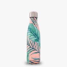 a pink and green water bottle with palm leaves on it