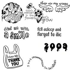 some stickers that are on the side of a white paper with words and symbols