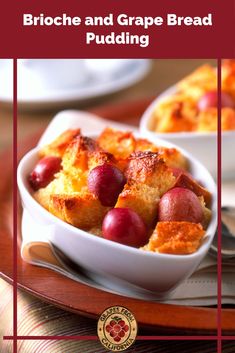 bread pudding with grapes in a white bowl