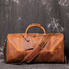 Product information: Capacity: 56-75L Internal structure of the bag: camera pocket Material: Leather Cortical features: top layer cowhide Strap root number: single Carrying parts: soft handle Function: storage, wear-resistant Size: 50x23x26cm Packing list: Luggage Bag*1 Brown Leather Duffle Bag With Large Capacity, Brown Leather Travel Bag With Large Capacity, Large Capacity Brown Leather Duffle Bag, Brown Large Capacity Travel Bag For Outdoor, Large Capacity Brown Leather Travel Bag, Brown Rectangular Outdoor Luggage, Brown Rectangular Luggage For Outdoor, Outdoor Brown Rectangular Luggage, Brown Leather Duffle Bag With Pockets