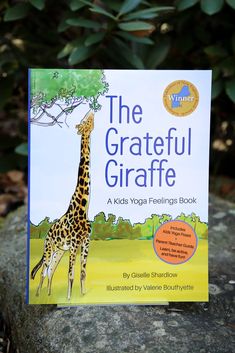 a children's book about the grateful giraffe is sitting on a rock