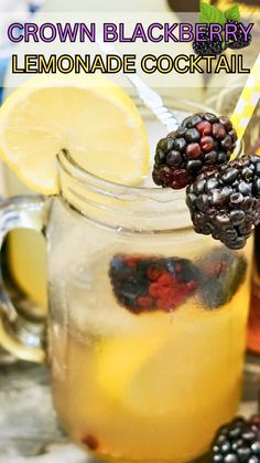 a lemonade cocktail in a mason jar with blackberries and raspberries