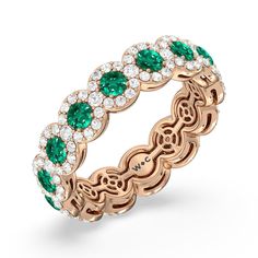 a rose gold ring with emeralds and diamonds