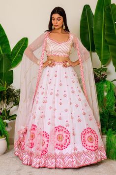 Icy pink lehenga with beads and sequin embroidery. Comes with embroidered blouse and dupatta.
Component: 3
Pattern: Embroidery
Type Of Work: Sequin and Beads
Neckline: Leaf
Sleeve Type: Half
Fabric: Organza
Color: Pink
Other Details: 
Cutwork detail on the hems
Embroidered dupatta with cutwork border
Cutout at the back with tie up
Closure: Back hook
Occasion: Wedding - Aza Fashions Pink Embroidered Fabric With Dori Work For Reception, Pink Bollywood Embroidered Choli, Pink Embroidered Bollywood Choli, Pink Embroidered Fabric With Pallu For Reception, Pink Embroidered Lehenga For Navratri, Pink Embroidered Lehenga For Festivals, Pink Embroidered Lehenga For Reception, Festive Pink Embroidered Lehenga, Pink Embroidered Fabric For Eid Reception