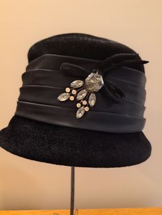 Vintage women's dress black velour hat with black satin ribbon and brooch, Women's black hat, Vintage black Velour hat with beautiful rhinestone brooch. inside brim is 25", height is 5" Elegant Fedora Felt Hat For Party, Elegant Party Fedora Felt Hat, Winter Evening Brimmed Mini Hats, Elegant Felt Hat For Evening In Winter, Elegant Winter Cloche Hat For Party, Chic Black Felt Hat For Evening, Elegant Winter Felt Hat For Evening, Elegant Winter Evening Felt Hat, Elegant Winter Party Cloche Hat