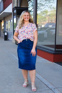 Simple and timeless, the Amy denim skirt is a great addition to your core wardrobe! Featuring front and hip pockets, a zip front and button closure, light distressing, and a slight A-Line fit. Made with stretch denim, bringing comfort to your everyday style! Guaranteed to go with just about anything from a casual tee to a flowy feminine blouse! Model is wearing size XL **Measurements are of actual non stretched garment. Fit will vary deepening on personal preferences. Waist Hips Length XSmall 29 Midi Denim Skirt, Core Wardrobe, Midi Denim, Feminine Blouses, Denim Midi Skirt, Casual Tee, Everyday Style, Hip Length, Stretch Denim