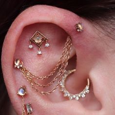 the ear is adorned with many different types of jewelry