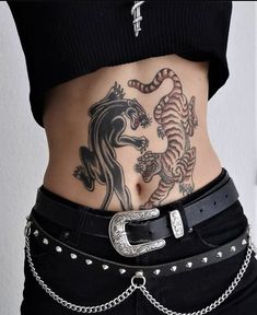 a woman with a tattoo on her stomach has a belt around her waist and two tigers