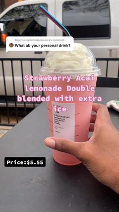 someone holding up a pink drink with whipped cream in it and the caption reads strawberry acai lemonade double blended with extra ice