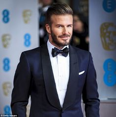 Beckham was wearing a navy blue suit and black lapel for the prestigious British awards ceremony Groom Tuxedo Navy, Wedding Flowers Navy Blue, Blue Tux, Navy Tuxedos, Blue Tuxedo, Groom Wedding Attire