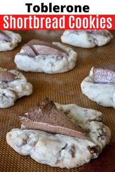 there are cookies with chocolate on top and the words toblerone shortbread cookies above them