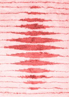 a red and white rug with lines on it