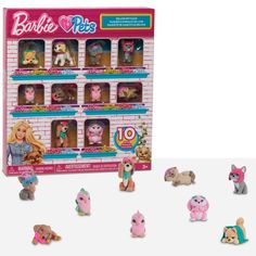 barbie dolls and other toys are in a display case with the doll's name on it