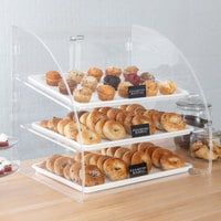 three tiered trays filled with different types of pastries