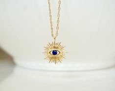 "Beautiful Evil Eye and Gold Medallion Necklace The charm on this necklace symbolizes good luck and safe keeping. Perfect to wear everyday! Great holiday gift for Mom, Sister, Daughter or best friend! On trend, perfect layering necklace. Choose the your favorite eye color from the second drop down menu -Details Copper, 18K Gold Filled - Size: 15mm x 17mm - Color: Gold - Stone : blue, clear or turquoise Link Chain - 14kt Gold Filled Length - 14 - 40\" Please select the necklace length from the dr Blue Evil Eye Necklace, Evil Eye Blue, Gold Medallion Necklace, Double Horn Necklace, Evil Eye Necklace Gold, Gold Medallion, Horn Necklace, Medallion Necklace, Blue Evil Eye