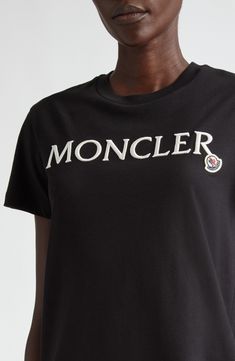 Showcase your brand allegiance in this soft cotton T-shirt detailed with an iconic Moncler patch and embroidered lettering. Crewneck Short sleeves 100% cotton Machine wash, dry flat Imported Designer Clothing Black Cotton T-shirt With Embroidered Logo, Designer Cotton T-shirt With Embroidered Logo, Cotton Crew Neck T-shirt With Appliqué Logo, Designer Embroidered Logo Crew Neck Top, Classic Black Top With Logo Patch, Designer Crew Neck Top With Embroidered Logo, Designer Crew Neck Tops With Logo Detail, Designer Crew Neck Top With Logo Detail, Graphic Tee With Appliqué Logo For Streetwear