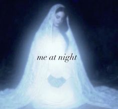 a woman wearing a white veil with the words me at night in front of her