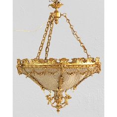 an antique chandelier hanging from the ceiling