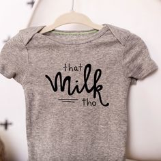 a gray shirt with the words that milk tho on it hanging from a hanger