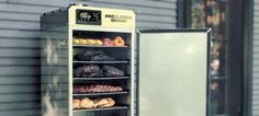 a display case with donuts and pastries in front of a storefront window