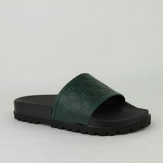 Designer Green Sandals With Round Toe, Luxury Green Sandals With Round Toe, Luxury Green Round Toe Sandals, Designer Flat Green Sandals, Designer Synthetic Slip-on Sandals, Designer Green Flat Sandals, Designer Flat Synthetic Sandals, Luxury Green Flat Sandals, Designer Sandals With Textured Footbed And Round Toe