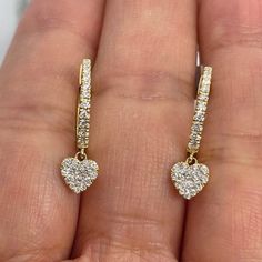 Beautiful Dangling Heart Diamond Earrings Yellow Gold.   Wear these hoop earrings with anything.  Excellent craftsmanship, the diamonds are very sparkling.  The heart drop dangles beautifully a little bit from the lob, catching the light every time you move.  The backs snap tightly for a secure fit.  Measures about 20mm length.  The heart dangle is snot 5.5mm.  Special price.  Genuine Earth Mined Round Brilliant Cut Diamonds Natural  Total weight: 0.54  carats Clarity: SI/I Color: G nice and spa Heart-shaped Yellow Gold Diamond Earrings, Yellow Gold Heart-shaped Diamond Earrings, Heart-shaped Diamond Earrings In Yellow Gold, Teardrop Earrings With Heart Charm For Anniversary, Anniversary Teardrop Earrings With Heart Charm, Yellow Gold Heart Pendant Earrings For Weddings, Heart Shaped Yellow Gold Diamond Cut Earrings, Yellow Gold Heart Earrings With Diamond Cut, Yellow Gold Heart Cut Earrings With Diamond Accents