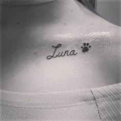 a woman's chest with the word luna written in cursive writing on it