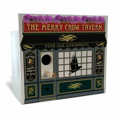 the merry crow tavern has been painted on to it's front window and is decorated with purple flowers