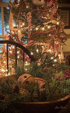 a decorated christmas tree with lights and ornaments