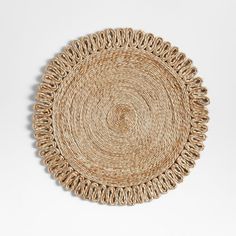 a round woven placemat on a white background