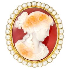 A Victorian hardstone cameo brooch, the hardstone cameo depicting a profile of lady in Roman style wearing rose wreath, surrounded by a thirty five pearls, all set in yellow gold mount with scalloped edges and brooch fitting, circa 1860, measuring approximately 4.5 x 5.3cm, gross weight 39.3 grams. Unmarked (all parts) tested as 18ct gold. Victorian brooch in Excellent condition. A classic Victorian cameo brooch from the collection of Bentley & Skinner, the London jewellers by appointment to bot Beltane Flowers, Flowers Garland, Hair Brooch, Roman Style, Roman Fashion, Cameo Jewelry, Her Majesty The Queen, Rose Wreath, Antique Brooches