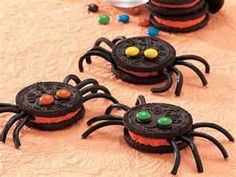 some cookies are decorated to look like black spider cookies