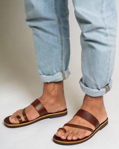 Greek leather sandals for men are a timeless and classic choice in footwear. They are handmade from high-quality leather and are both comfortable and durable. Their simple yet elegant design makes them a must-have for any fashion-conscious man's wardrobe, and they are suitable for any occasion, from a casual day out to a more formal event. All of our products are handmade with the best and highest quality leather from our beloved island of ''Crete''.  The leather used for each item may be irregu Summer Shoes Men, Leather Sandals Men, Minimalist Sandals, Sandals Greek, Summer Leather Sandals, Mens Summer Shoes, Toe Ring Sandals, Mens Shoes Sandals, Roman Sandals